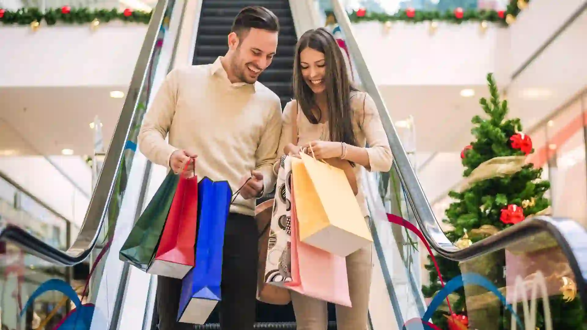 Loving couple doing Christmas shopping together stock photo