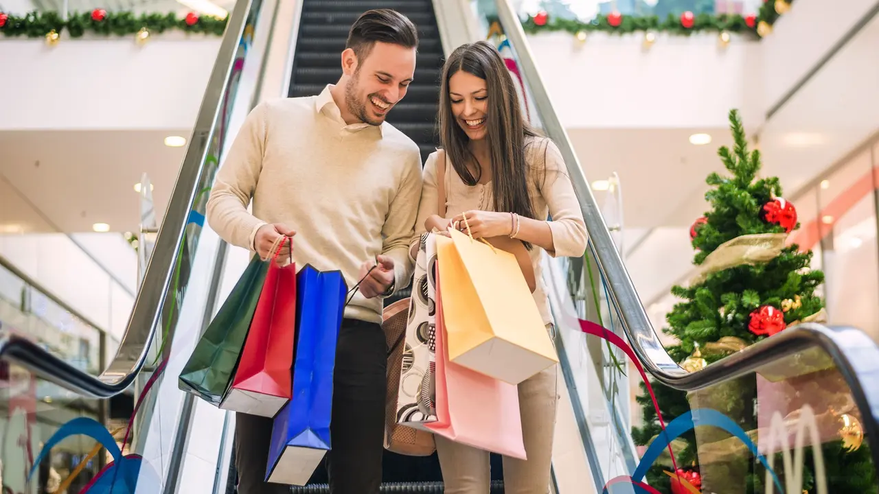 Loving couple doing Christmas shopping together stock photo