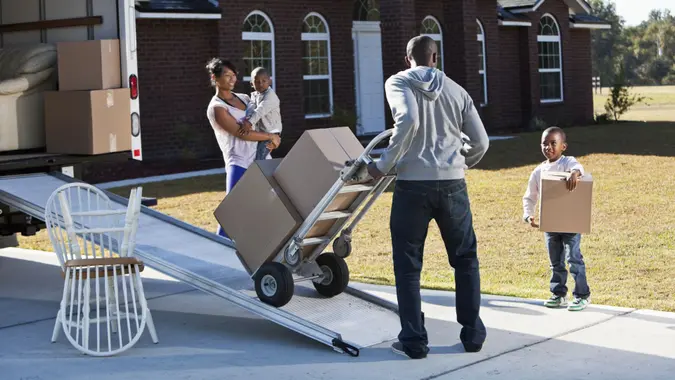 African American family moving house.