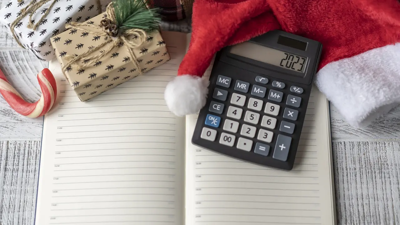 https://cdn.gobankingrates.com/wp-content/uploads/2022/12/holiday-christmas-hats-gifts-2023-calculator-screen-personal-finance-new-year-concept_iStock-1441828242.jpg?webp=1&w=1280&quality=75