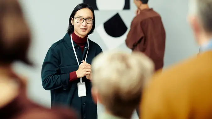 Young Man Giving Art Museum Tour stock photo