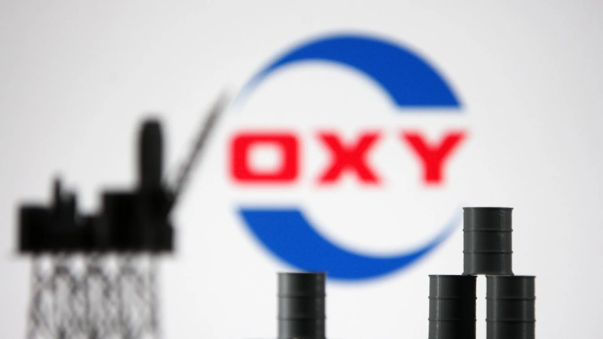 Mandatory Credit: Photo by Vladimir Sindeyeve/NurPhoto/Shutterstock (12342408u)Occidental Petroleum Corporation (OXY) logo and models of an oil rig and oil barrels are pictured in this illustration photo taken in Kyiv on 19 August, 2021.