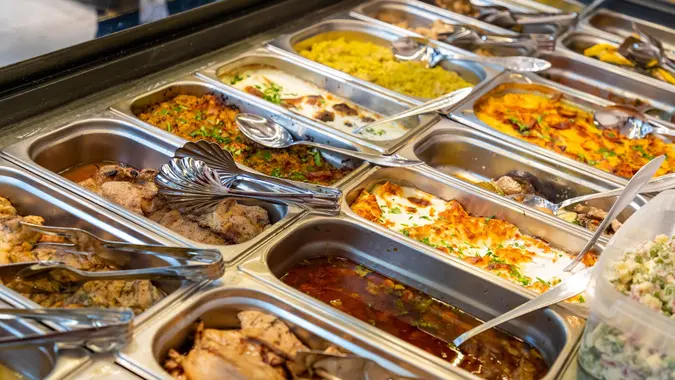 Cooked food in trays in buffet stock photo