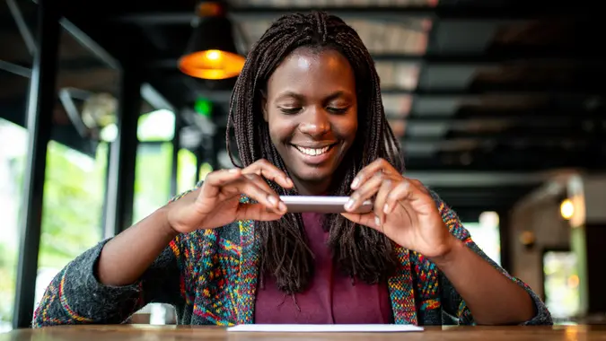 Check remote deposit capture at coffee shop stock photo