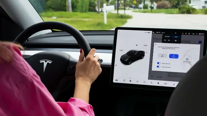 Miami, FL, United States - September 13, 2021: A cockpit with LCD touch screen of electric car Tesla Model Y during drive in Miami, USA.