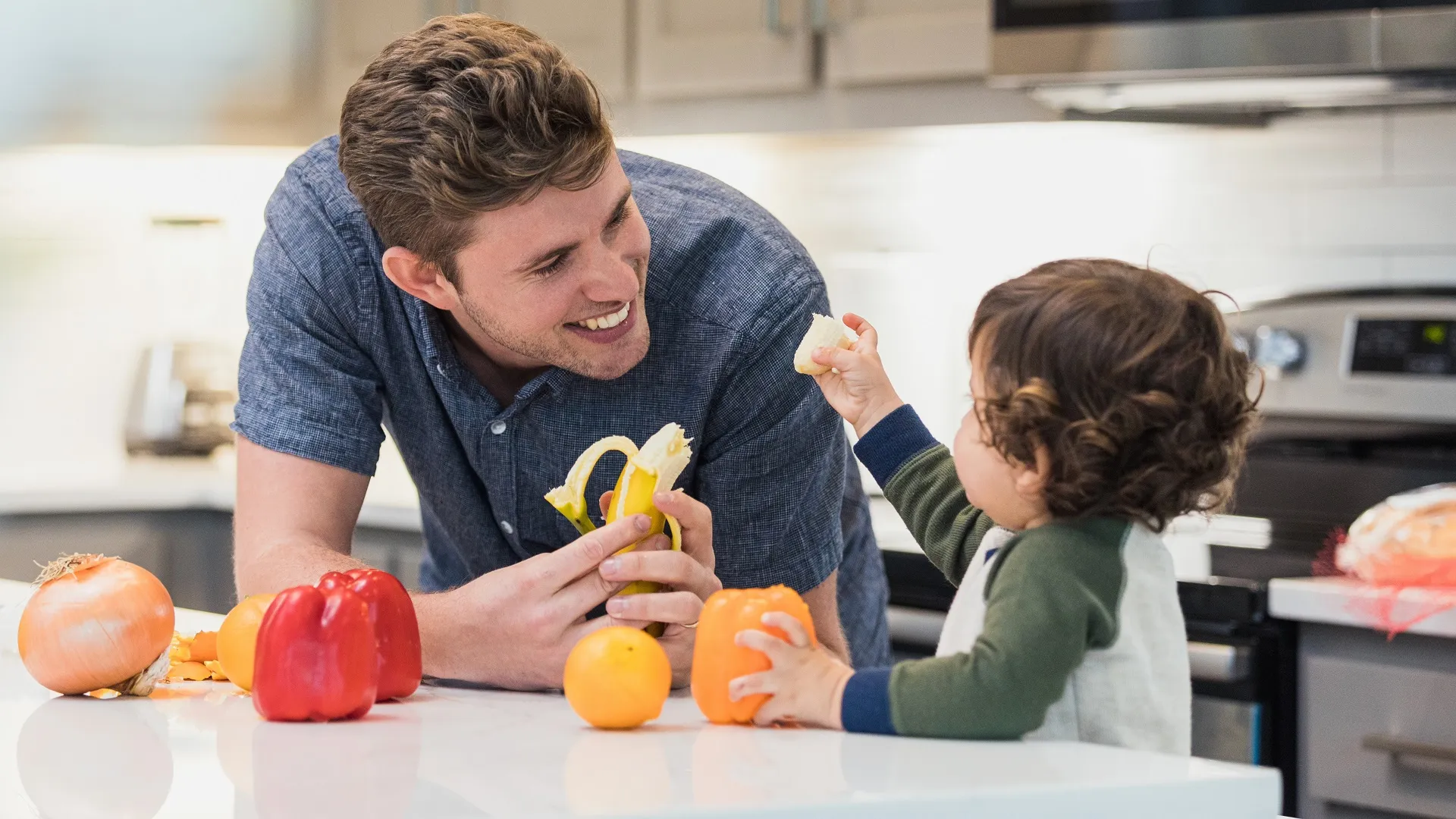 Father son share healthy snack stock photo