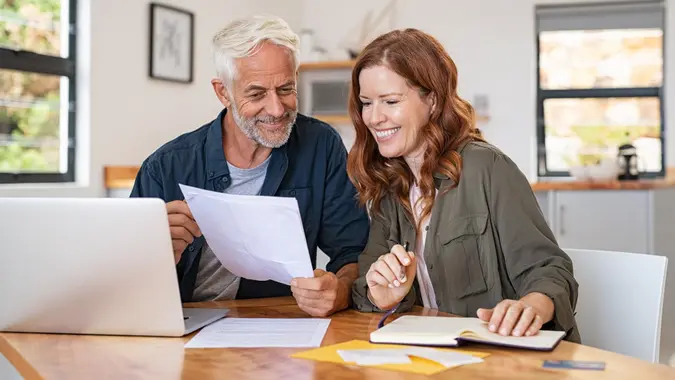 Couple working on laptop stock photo