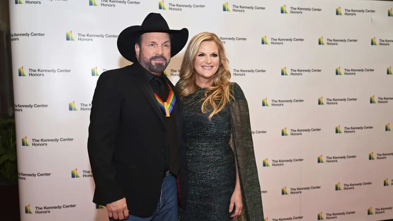 Mandatory Credit: Photo by Kevin Wolf/AP/Shutterstock (13648236ab)Kennedy Center honoree, country singer-songwriter Garth Brooks stands with his wife, Trisha Yearwood, after arriving at the State Department for the Kennedy Center Honors gala dinner, in WashingtonKennedy Center Honors State Department Dinner, Washington, United States - 03 Dec 2022.