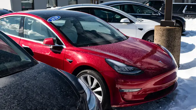 February 28, 2022 - Halifax, Canada - Used Tesla model 3 sedans available to purchase at an all electric car dealership.