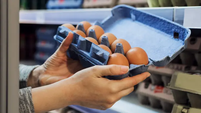 Buying eggs in a supermarket stock photo