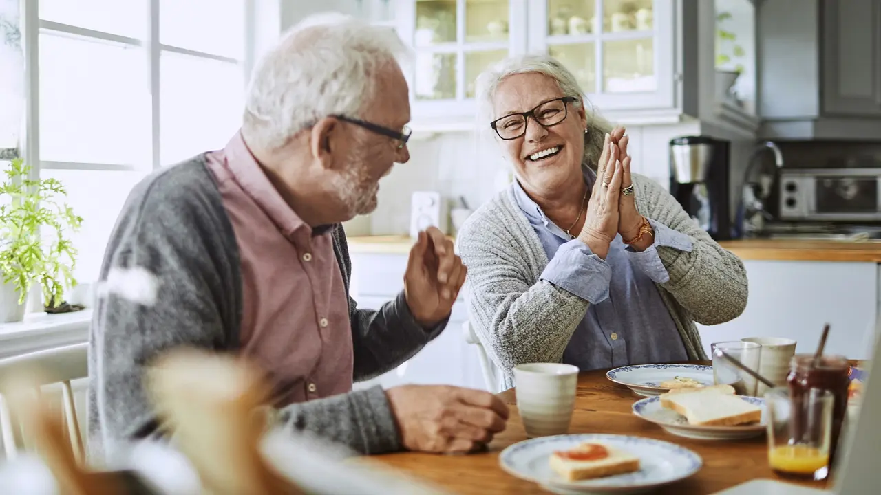 Senior couple having a look at their bills stock photo