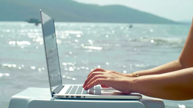 The concept of working on the summer beach.