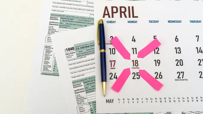 tax forms and next to the calendar with a date mark when you need to file a return.