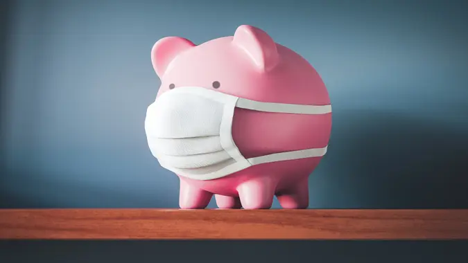 Piggy Bank with Face Mask stock photo