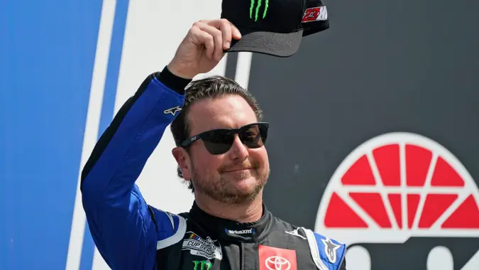 Mandatory Credit: Photo by Charles Krupa/AP/Shutterstock (13467554a)NASCAR Cup Series driver Kurt Busch tips his cap prior to the NASCAR Cup Series auto race at the New Hampshire Motor Speedway, in Loudon, N.
