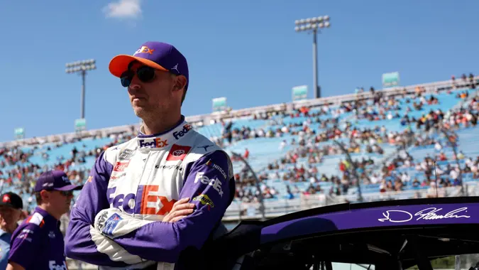 Mandatory Credit: Photo by Terry Renna/AP/Shutterstock (13489102j)Driver Denny Hamlin leans on his car before a NASCAR Cup Series auto race at Homestead-Miami Speedway, in Homestead, FlaNASCAR Cup Auto Racing, Homestead, United States - 23 Oct 2022.
