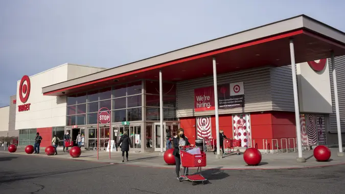 Portland, OR, USA - Jan 14, 2022: Masked shoppers outside a Target Store in northeast Portland, Oregon, during the Omicron variant surge.