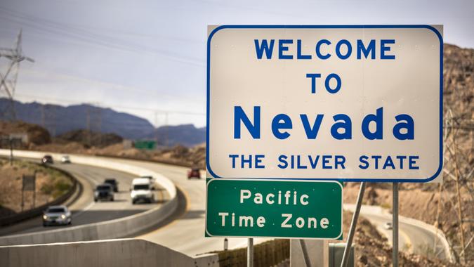 Entrance greeting sign on the highway border between Nevada and Arizona state USA.