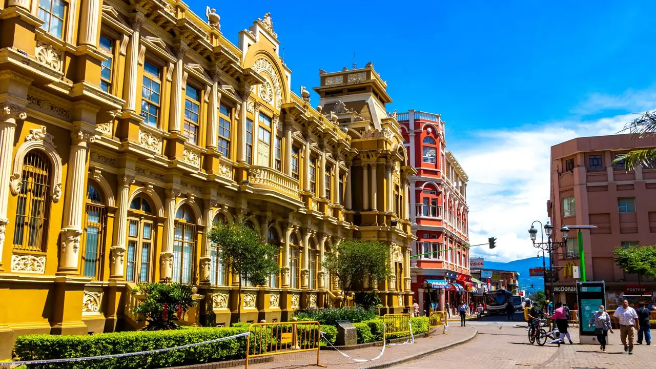 A street in San Jose, Costa Rica, with minor traffic, on a sunny day.