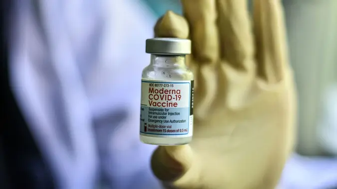 Mandatory Credit: Photo by Moch Farabi Wardana/Pacific Press/Shutterstock (12543989b)A health worker shows a bottle of the moderna covid 19 vaccine to the general public.