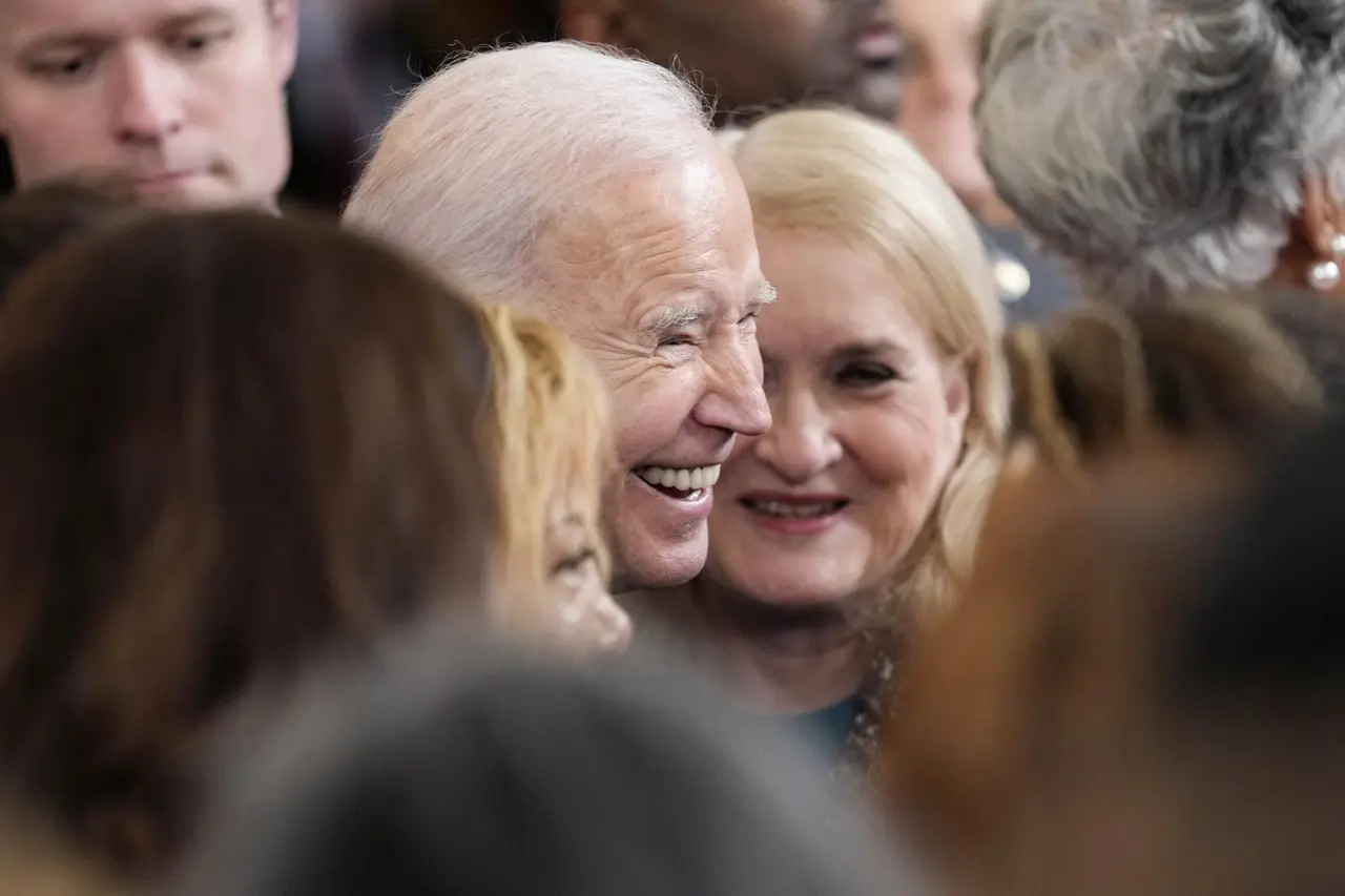 Mandatory Credit: Photo by Susan Walsh/AP/Shutterstock (13840913al)President Joe Biden meets people in the crowd after speaking during an event in the East Room of the White House in Washington, to celebrate women's history monthBiden, Washington, United States - 22 Mar 2023.