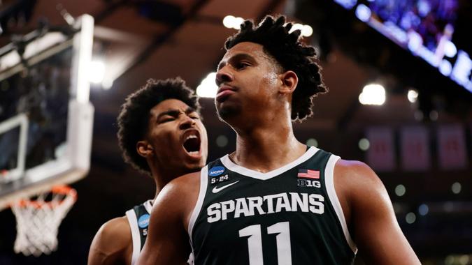 Mandatory Credit: Photo by Adam Hunger/AP/Shutterstock (13842731bu)Michigan State guard Jaden Akins yells at guard A.