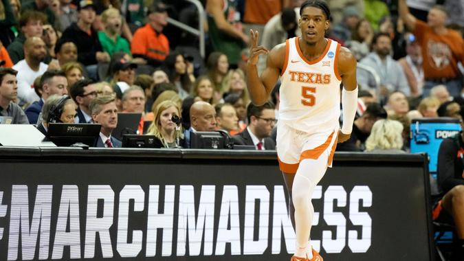 Mandatory Credit: Photo by Jeff Roberson/AP/Shutterstock (13846600j)Texas guard Marcus Carr celebrates after scoring against Miami in the first half of an Elite 8 college basketball game in the Midwest Regional of the NCAA Tournament, in Kansas City, MoNCAA Miami Texas Basketball, Kansas City, United States - 26 Mar 2023.
