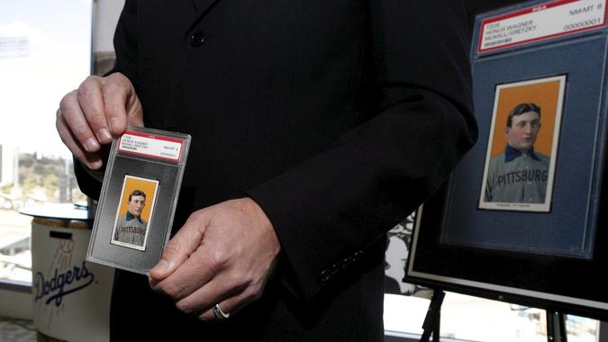 Mandatory Credit: Photo by Paul Buck/EPA/Shutterstock (7589083a)The T206 Honus Wagner Baseball Card is Displayed by Auction Company Officials at a Dodger Stadium Press Conference Announcing the Sale of the Card in Los Angeles California Tuesday 27 February 2007 the T206 Honus Wagner Card Recognized by Collectors As the Most Famous and Valuable Baseball Card in Existence Was Bought by a Private Collector in California For a Record $2 35 Million Dollars Previous Owners of the Card Include Wal-mart and Hockey Great Wayne GretzkyUsa Baseball Card Honus Wagner - Feb 2007.