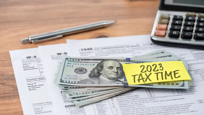 The 2020 TAX TIME note is on the hundred dollar bill.