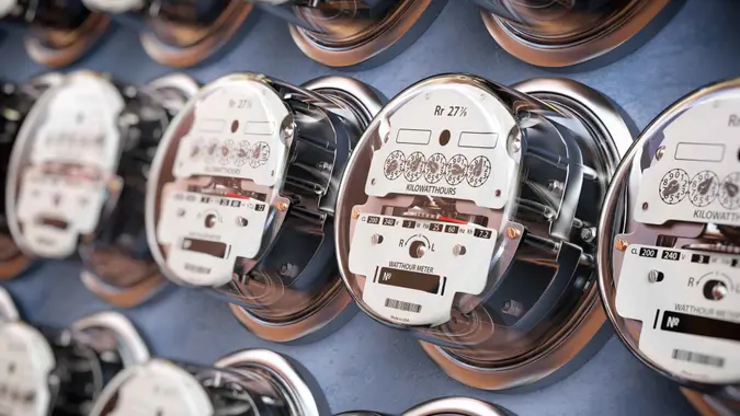 Electric meters in a row measuring power use.
