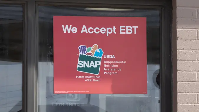 SNAP and EBT Accepted here sign. SNAP and Food Stamps provide nutrition benefits to supplement the budgets of disadvantaged families. stock photo