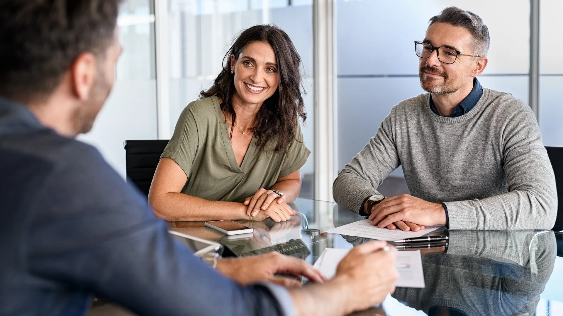 Mature couple meeting financial advisor for investment stock photo