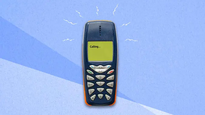 classic feature phone on paper background.