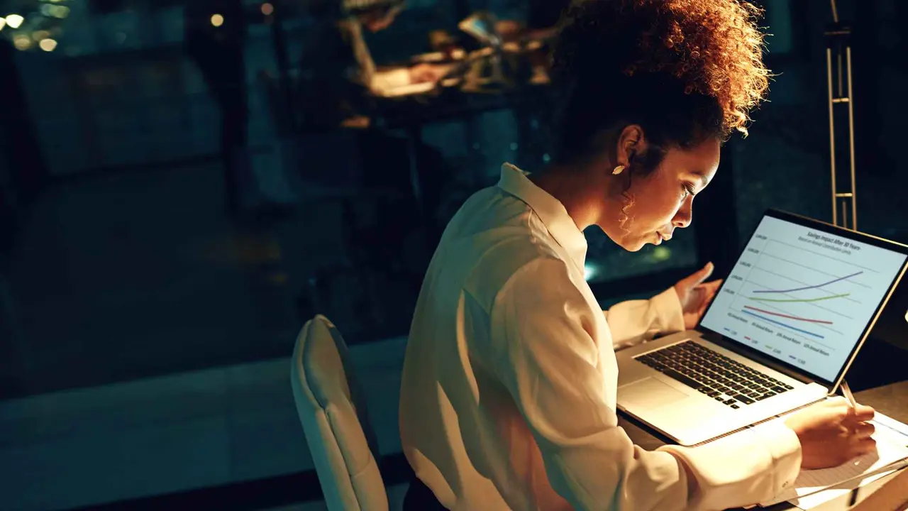 Shot of a young businesswoman working late in her office.