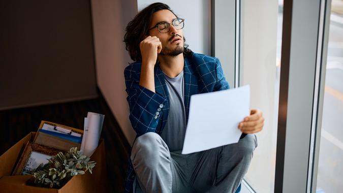 Young businessman feeling frustrated after being fired from his job. stock photo
