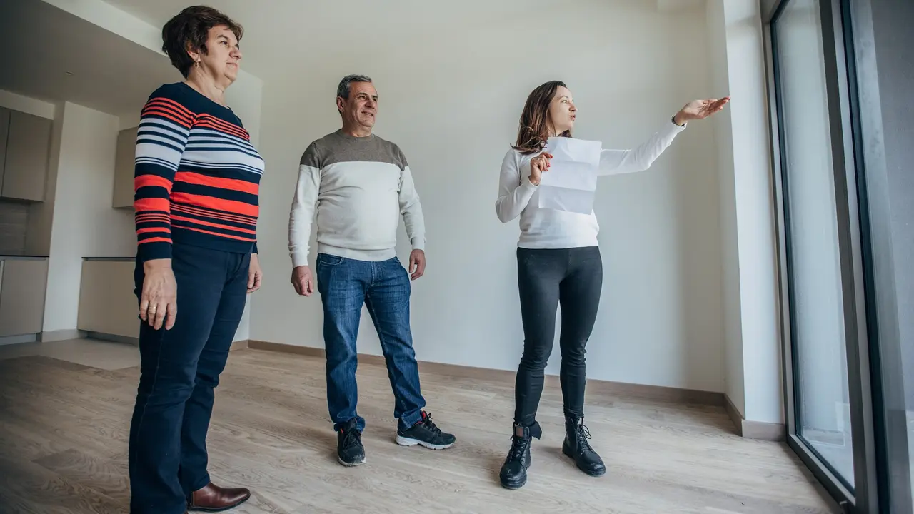 A real estate agent is selling an apartment stock photo