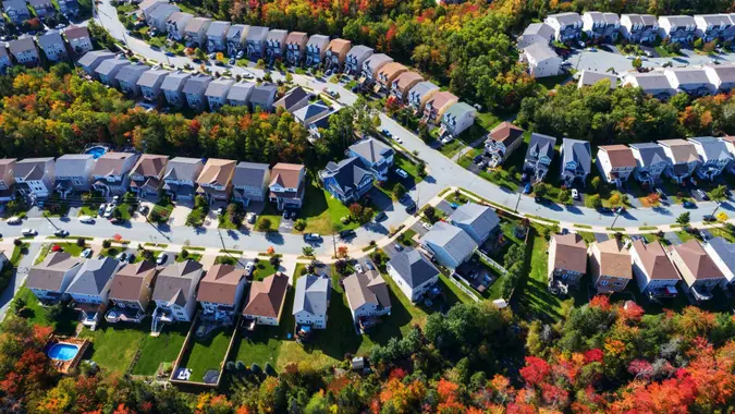 An aerial drone view of a suburban landscape in Autumn.