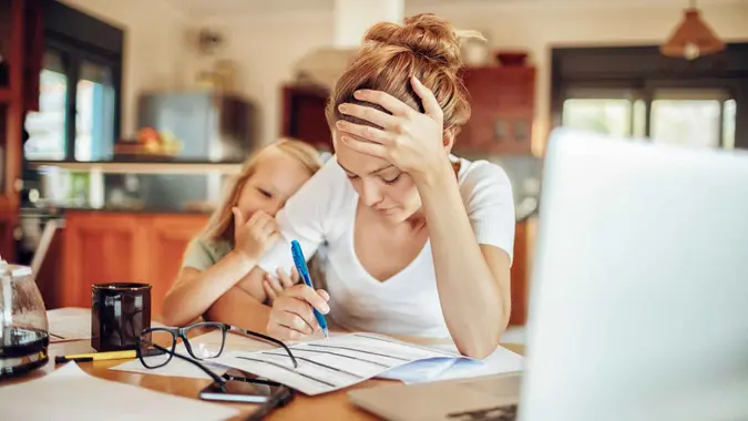 Close up of a mother going through her financials.