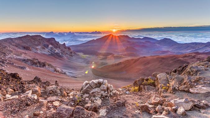 sunrise from the summit of Haleakala volcano on the tropical  island of Maui, Hawaii.