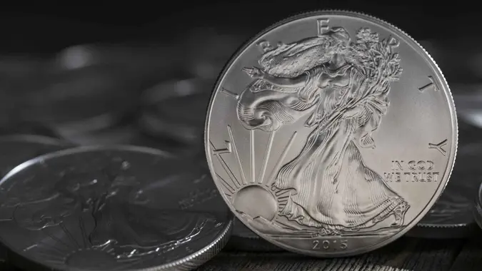 A stock photo of some 1 Ounce Silver Eagle coins.
