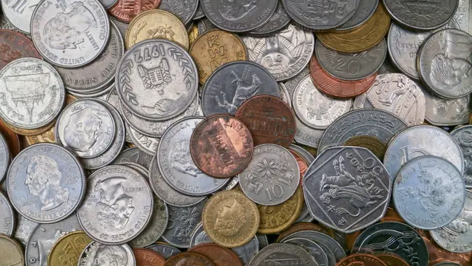 Stack of international coins stock photo