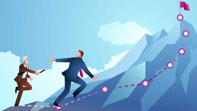 Older businessman passing the baton to younger businessman to continue running up the mountain, regeneration, teamwork, vector illustration.