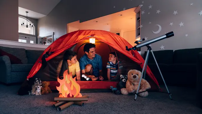A dad with his two sons camp inside their home due to the coronavirus restrictions and quarantine.