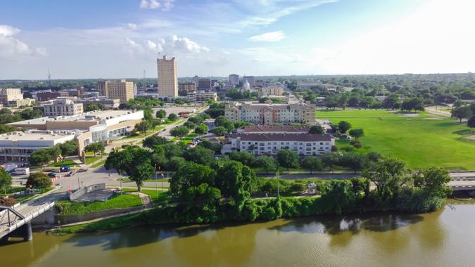 Aerial view riverside downtown Waco and Cultural District from Washington Avenue Bridge cross Brazos River.