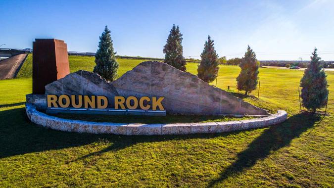 Highway turnaround travel destination Round rock , Texas small town aerial drone view looking straight down.