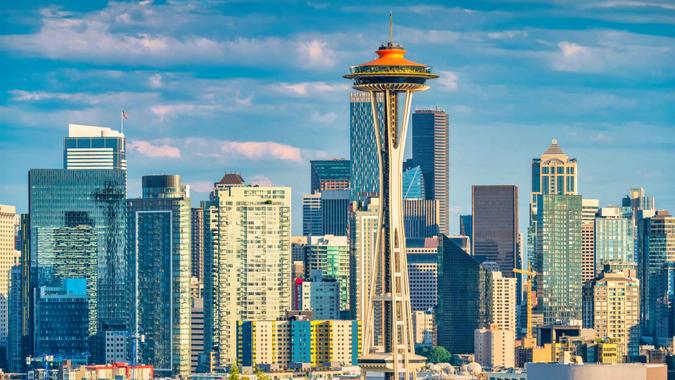 The skyline of Seattle, Washington, USA with the Space Needle observation tower on a sunny day.