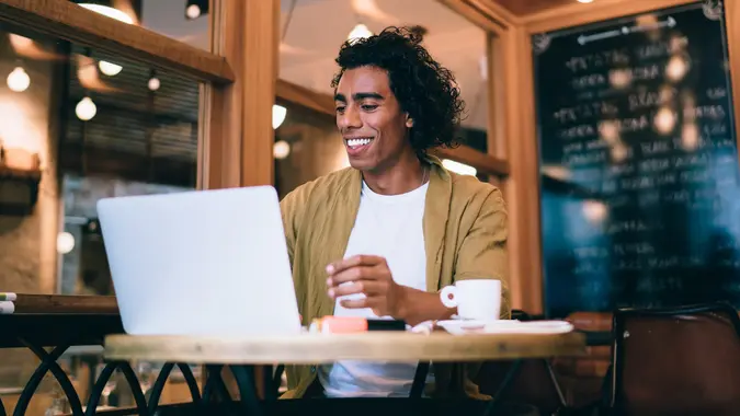 Man working at his desk and smiling