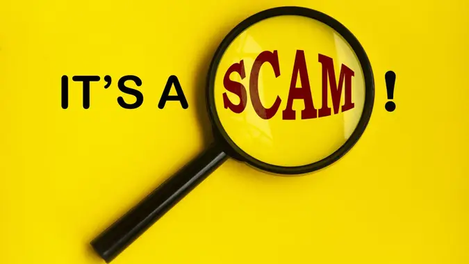 It's a scam text on yellow cover with magnifying glass.