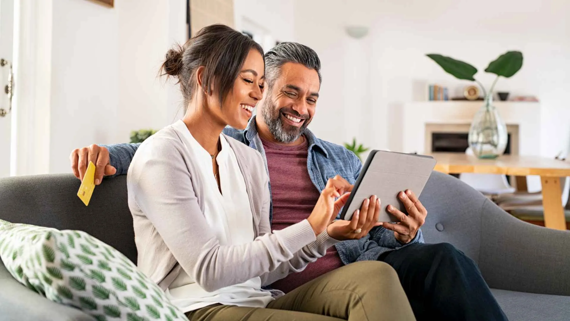 Happy couple browsing online.