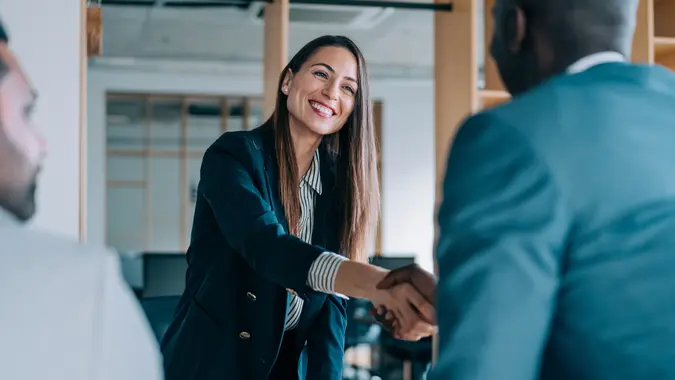 Business people shaking hands in the office.